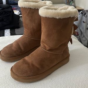 Brown uggs with bows.